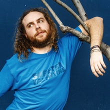 Load image into Gallery viewer, hanging out with a tree sexy look back model pose skeeter valentine teal turquoise shirt moist clothing and junk product photo
